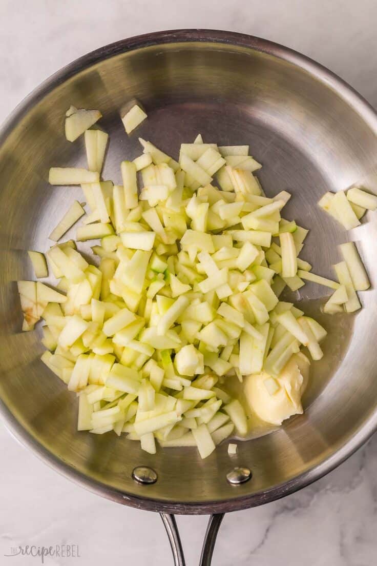 chopped apples in steel frying pan.