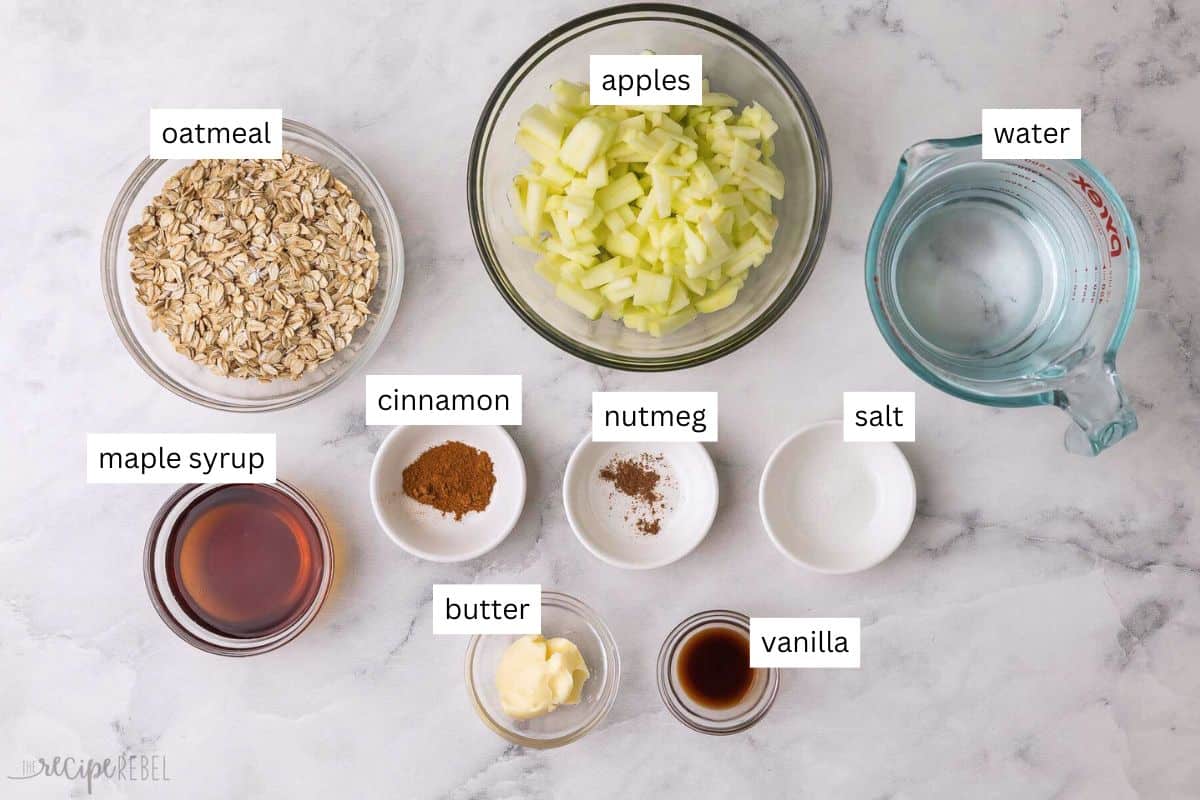 This Apple Cinnamon Oatmeal recipe is packed with chunks of fresh apples swirled throughout warm creamy oats and topped with maple syrup. It's ready in 20 minutes and is gluten-free, dairy-free, and meal prep-friendly! #breakfast #recipe #apples | apple oatmeal | oatmeal recipe | how to cook oatmeal | apple recipes ingredients needed for apple cinnamon oatmeal in bowls.