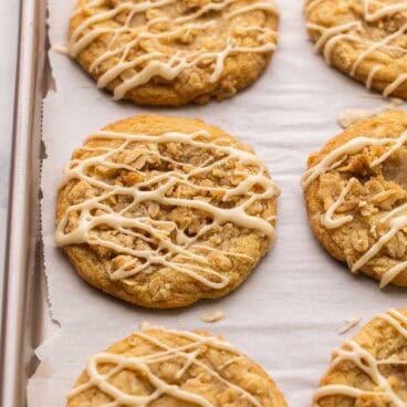 close up of a apple crisp cookie on parchment.