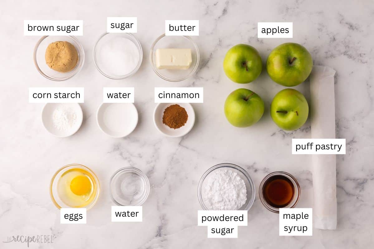 These easy Apple Turnovers are filled with a sweet apple filling inside store-bought puff pastry sheets and drizzled with a luscious maple glaze. It's like apple pie wrapped up in a flaky, buttery pocket of goodness! #apple #dessert #recipe | apple recipes | apple dessert | fall baking | puff pastry recipes | apple cinnamon | sweet treat ingredients needed for apple turnovers in bowls.