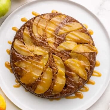 square overhead image of apple upside down cake with caramel drizzle.