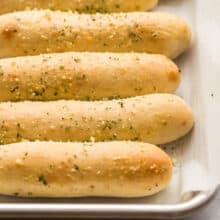 homemade breadsticks on a sheet pan