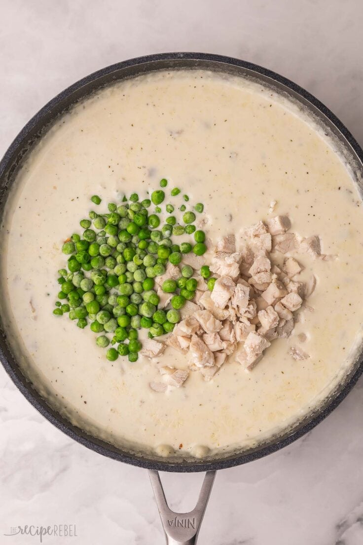 frozen peas and chopped chicken added to pan of other ingredients.