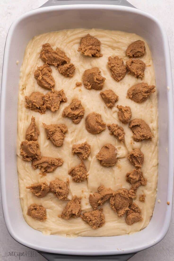 white pan with cinnamon roll ingredients added.