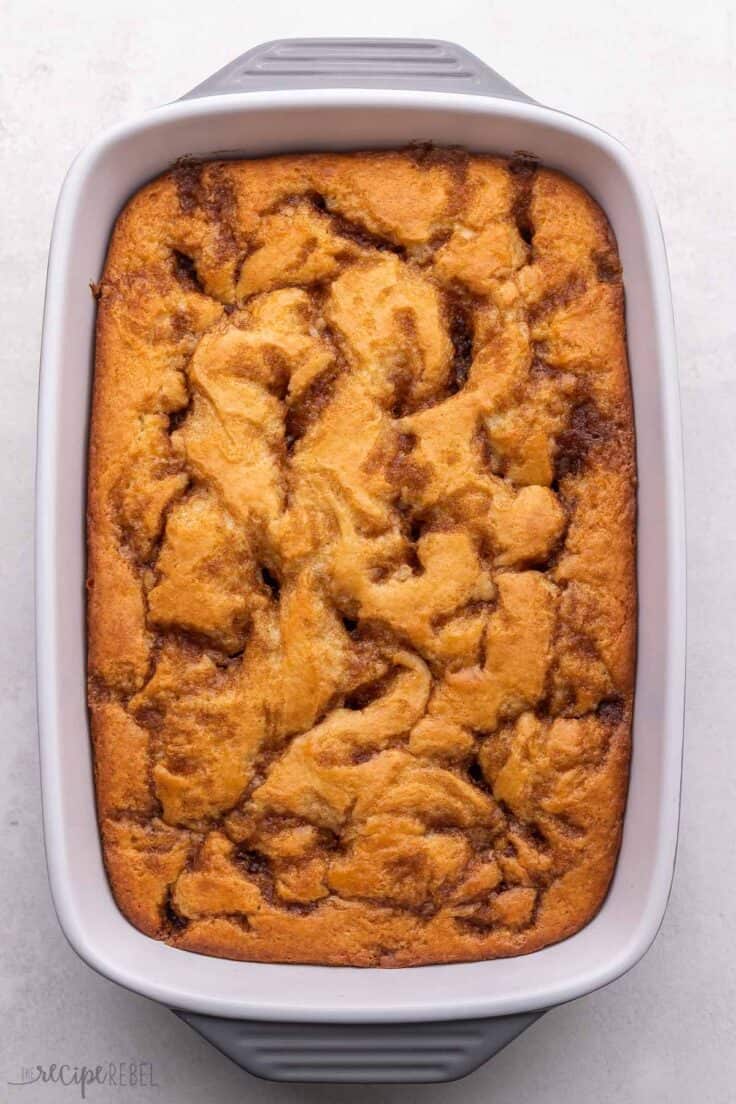 freshly baked cinnamon roll cake in baking pan.