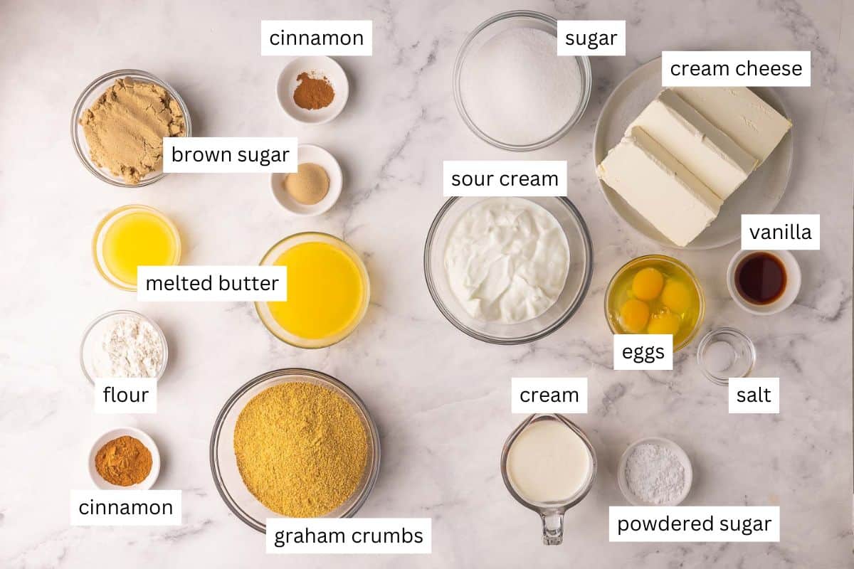 This Cinnamon Roll Cheesecake is made with a buttery cinnamon sugar filling between layers of rich, creamy cheesecake in a buttery graham cracker crust. No water bath and no cracks! | cheesecake recipe | cinnamon bun cheesecake | cinnamon rolls | cinnamon desserts | cinnamon recipes | holiday desserts | dessert recipe ingredients needed for cinnamon roll cheesecake in bowls.