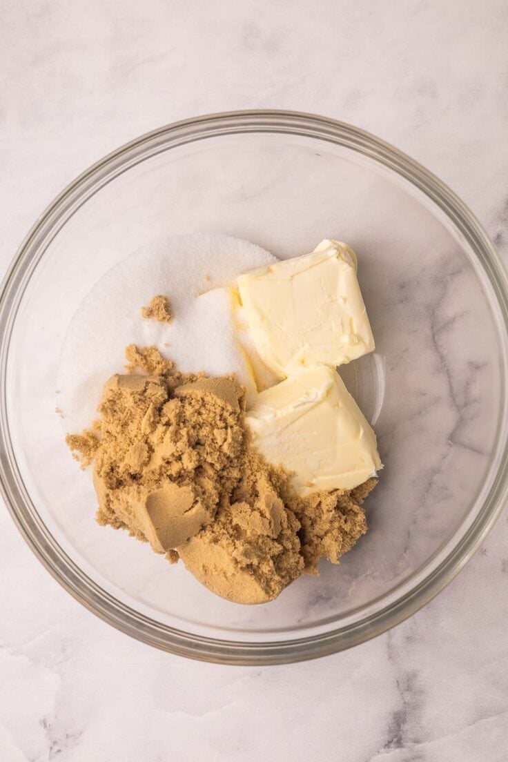 butter and sugars added to glass mixing bowl.