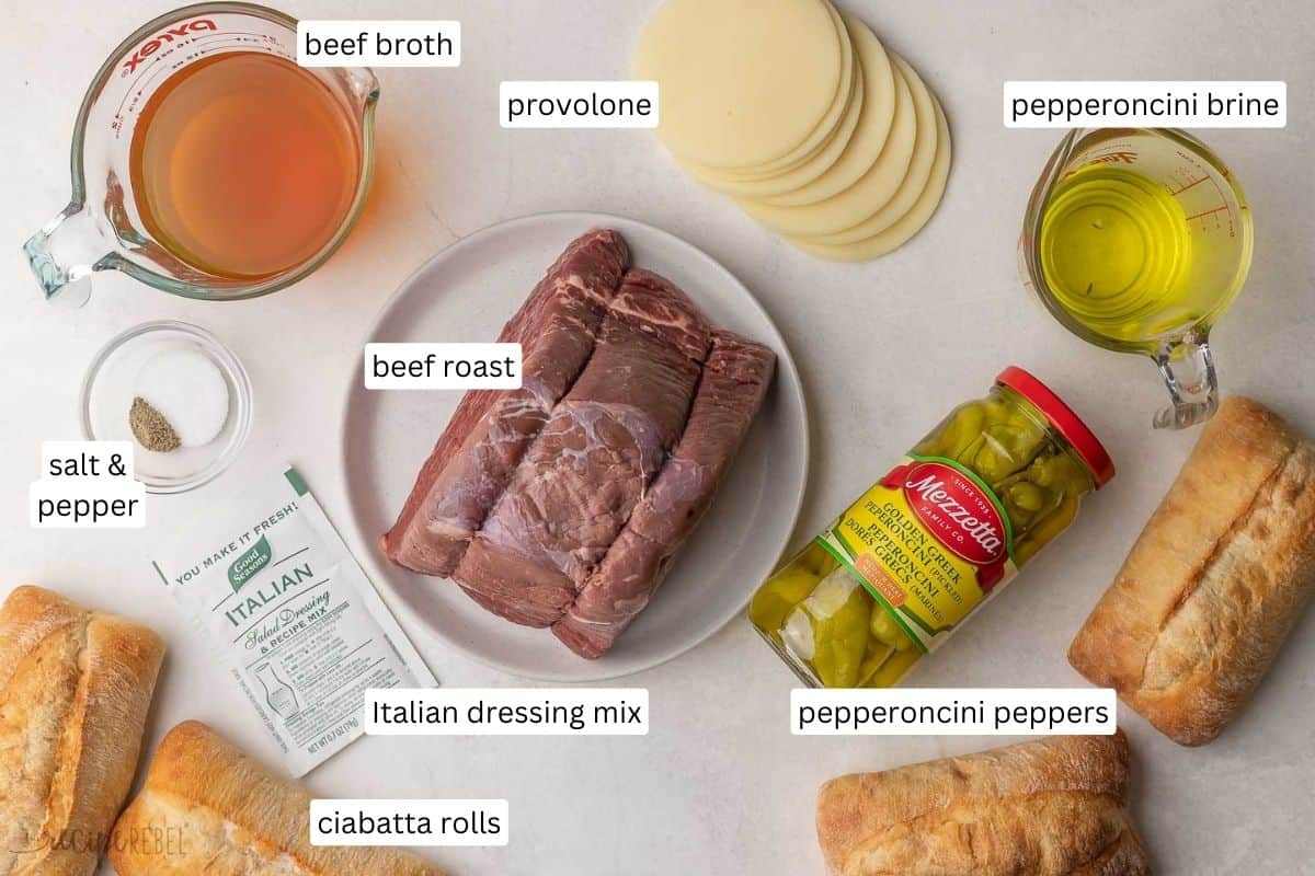 Easy shredded Italian Beef made in the crockpot, just six ingredients! Tender chuck roast is simmered in a tangy broth for fall-apart goodness, perfect for serving on sandwiches. Includes Instant Pot method and step-by-step video. #slowcooker #crockpot #recipe #dinner | beef roast recipe | beef recipe | roast beef | mississippi beef | sandwich recipe | crockpot dinner ingredients needed for crockpot italian beef.