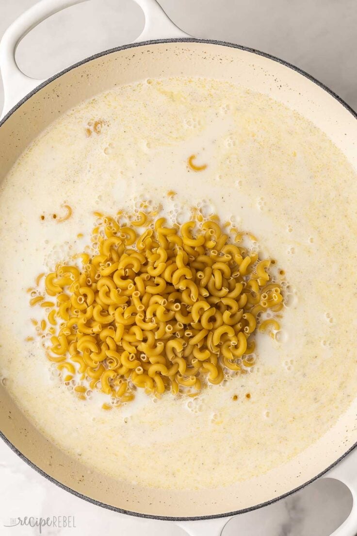 macaroni added to skillet with cream sauce.
