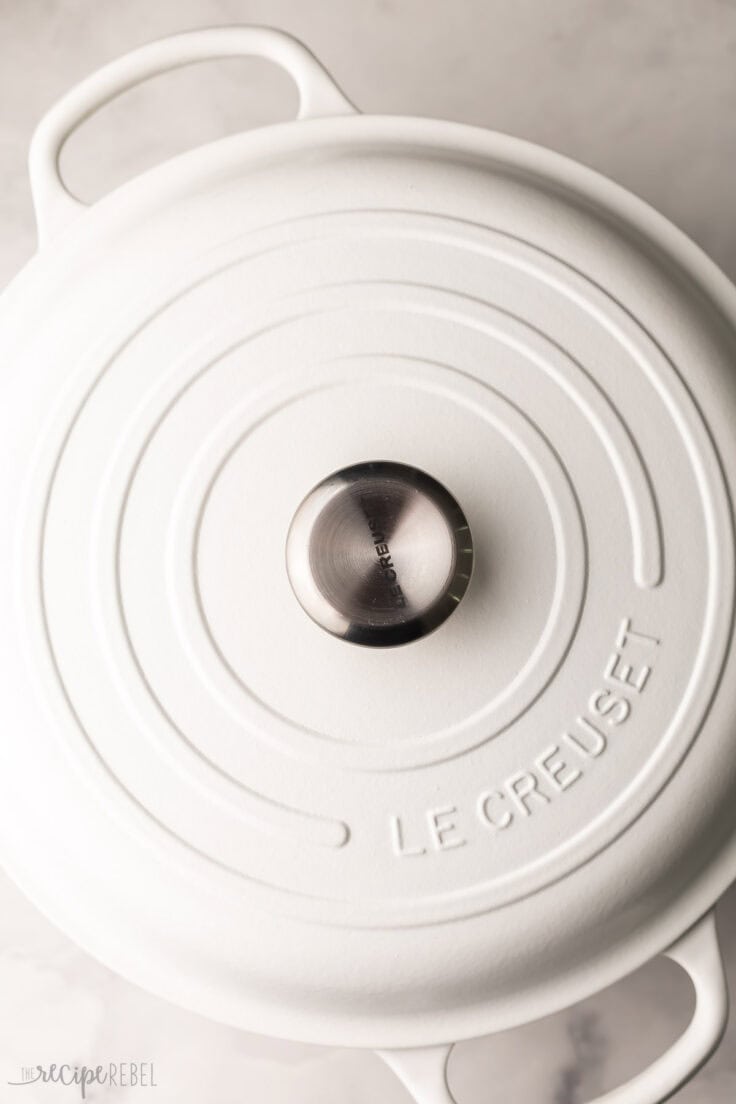 large white skillet with lid on.