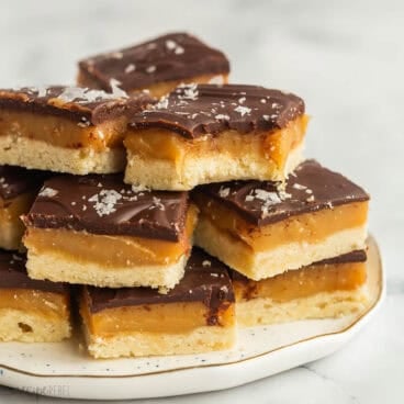 square image of stack of chocolate caramel shortbread.