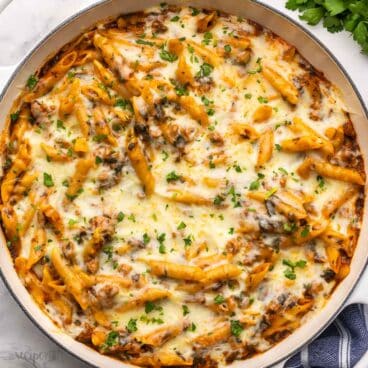one pot baked ziti in large dish topped with chopped parsley.